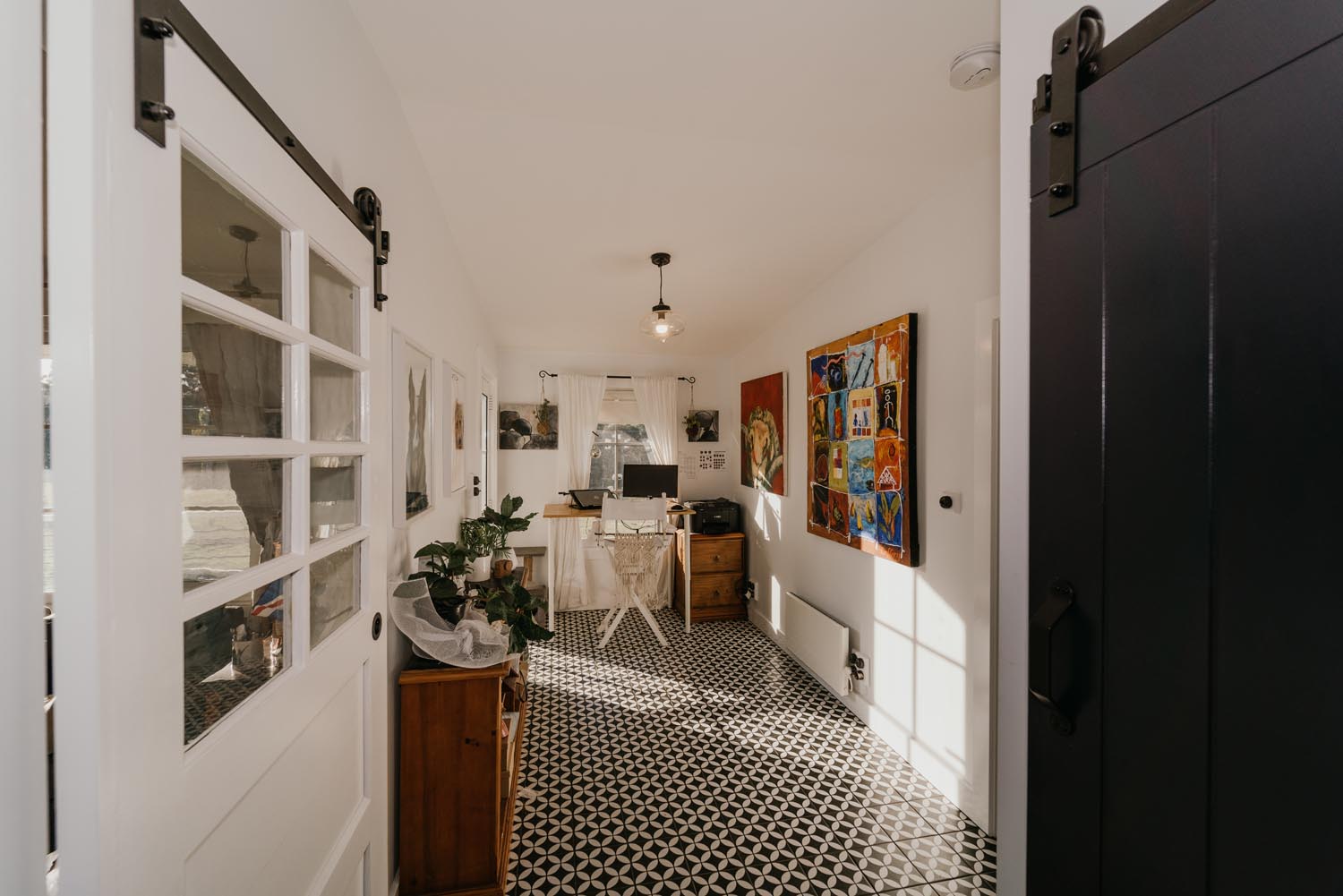 A uniquely styled study space with feature black and white floor tiles